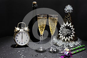 Fun New YearÃ¢â¬â¢s Eve Holiday Champagne With Hats, Glitter, Confetti, Clock & Noisemakers photo
